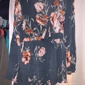 Floral romper with bell sleeves and a front cutout